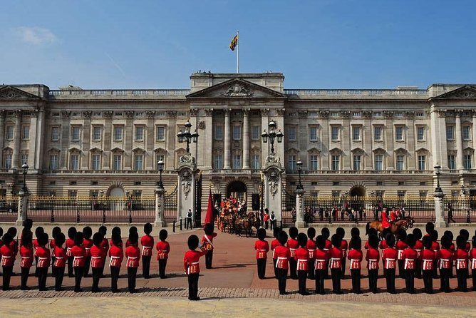 Changing the Guard on the forecourt of Buckingham Palace, guardsmen in red tunics and bearskins