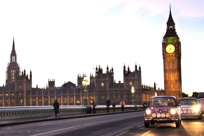 A classic Mini crossing Westminster Bridge at dusk with the Elizabeth Tower lit behind